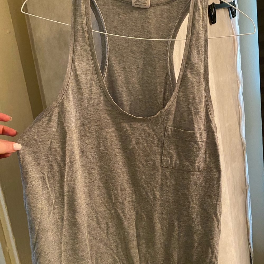Gray razor back tank with cute little pocket.
